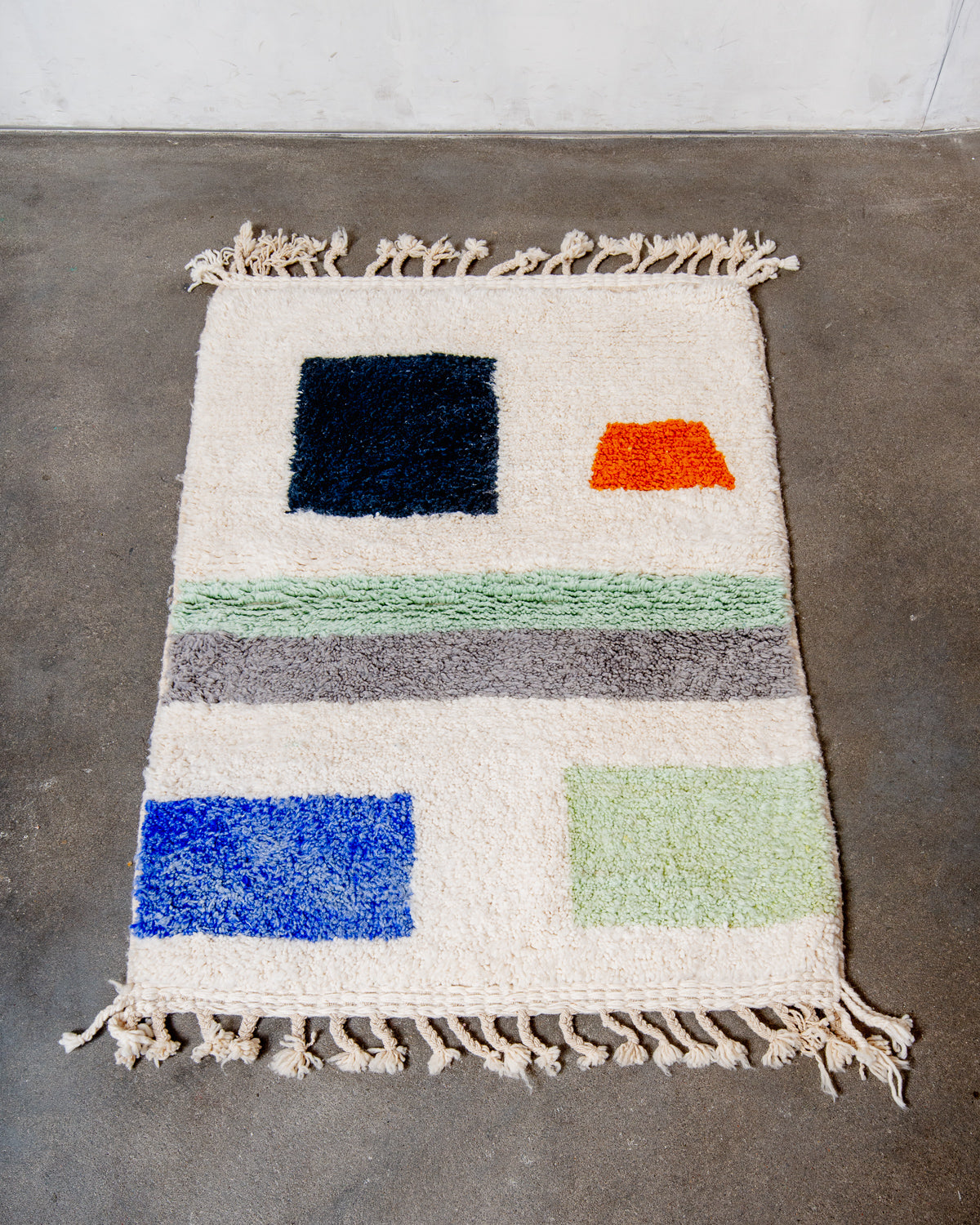 Modern, designer, handcrafted Berber rug from Morocco. Beniourain carpet with beautiful colours and patterns and fluffy wool texture.